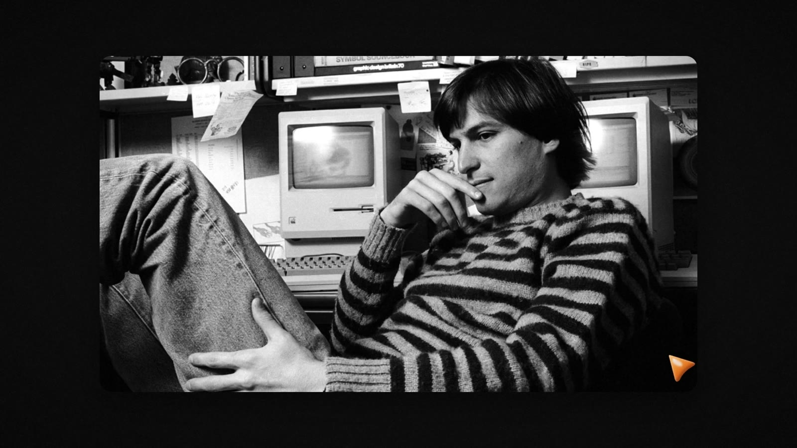 An archive photo of young Steve Jobs in the Apple story video